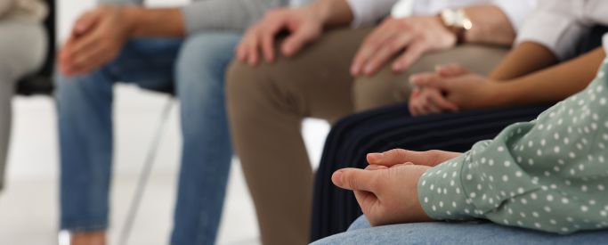 A shot of people's hands while sat in a cocaine rehab group therapy session - SBS Treatments